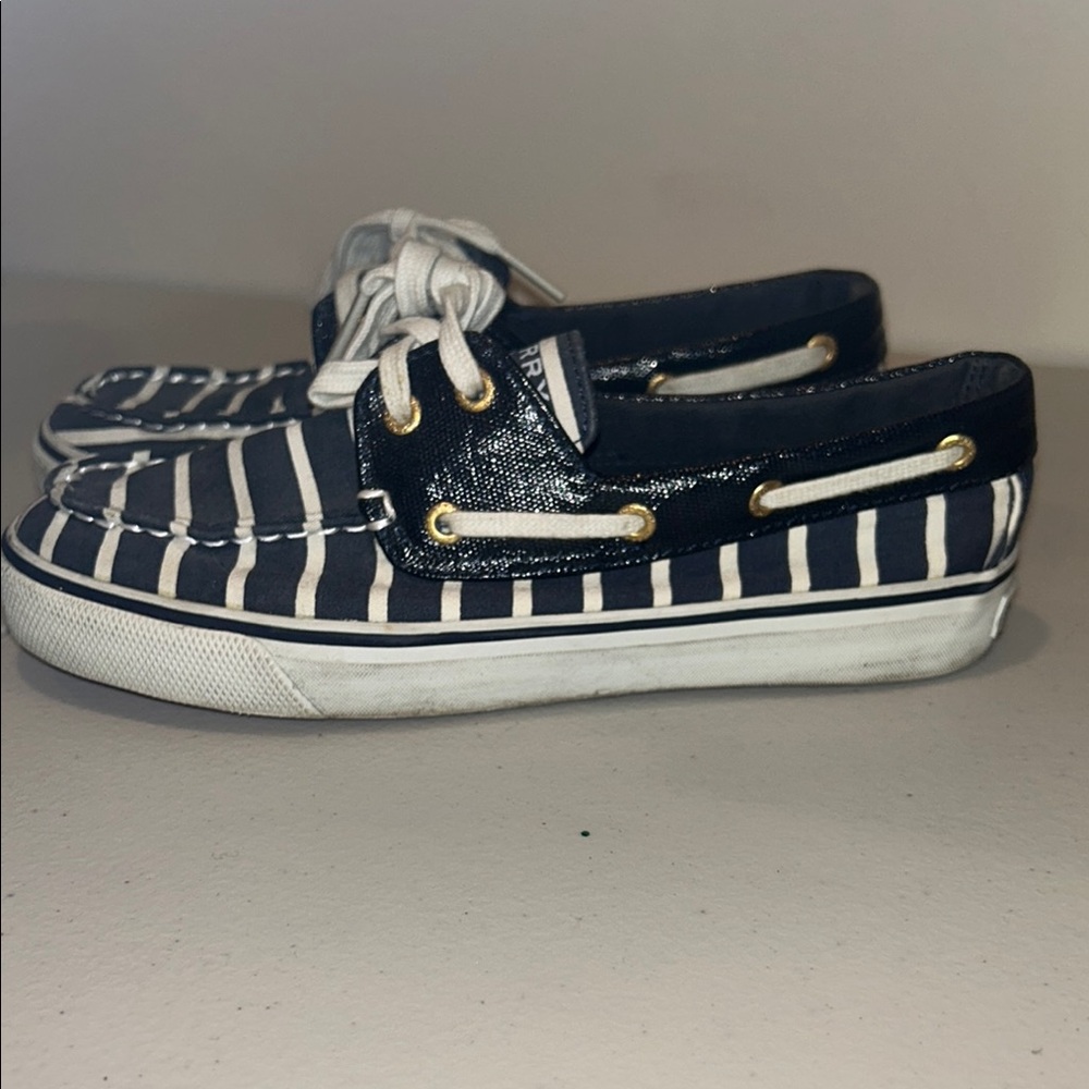 Sperry white and blue striped shoes.